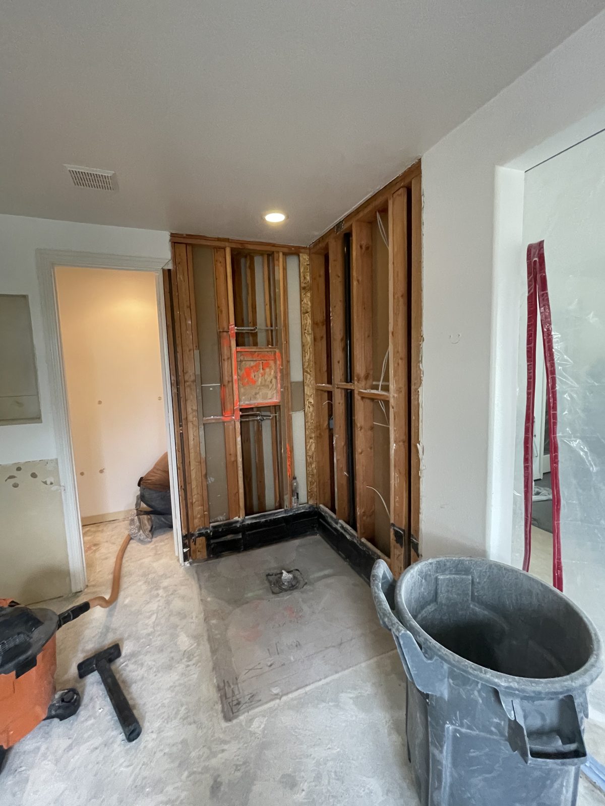 Master bathroom taken down to the studs during demolition and framing